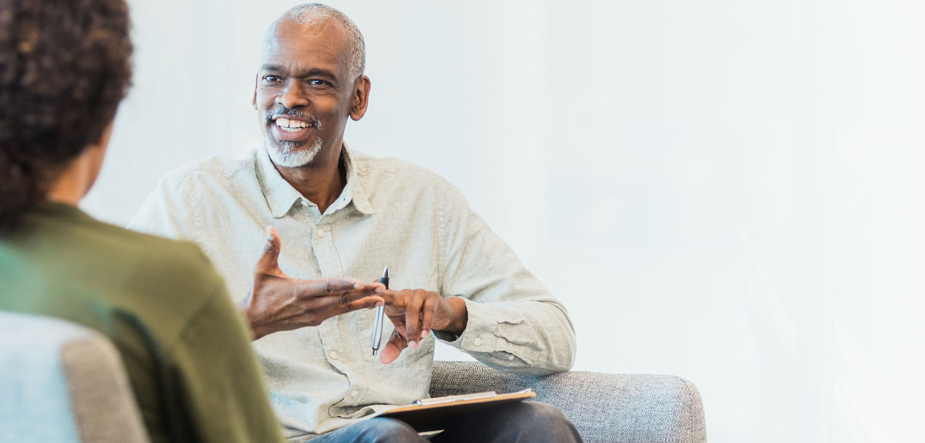A person counseling another person.